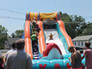 Inflatable slide with a child sliding down